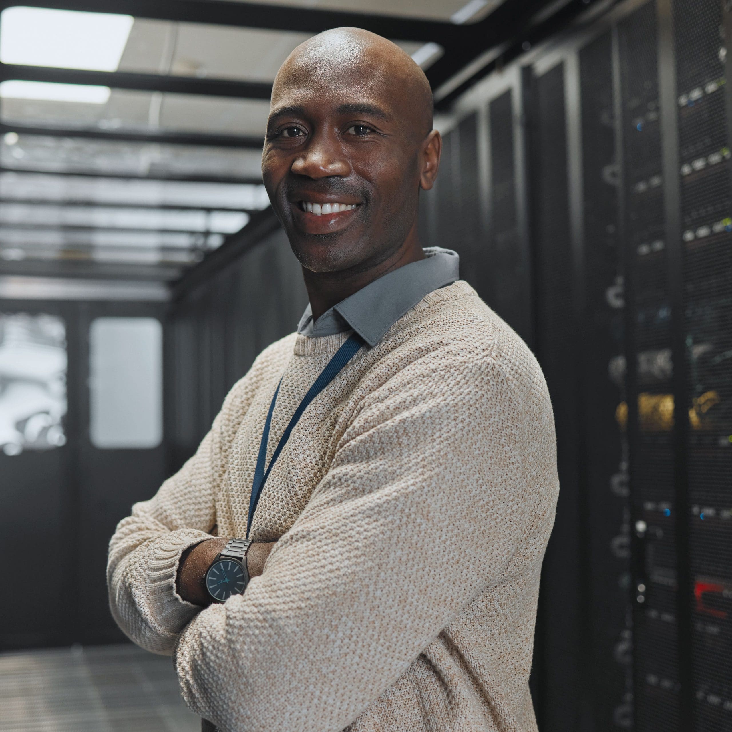 IT technician in server room and portrait with smile, company mainframe and software update. Network, datacenter and cybersecurity. African male and engineering with digital infrastructure
